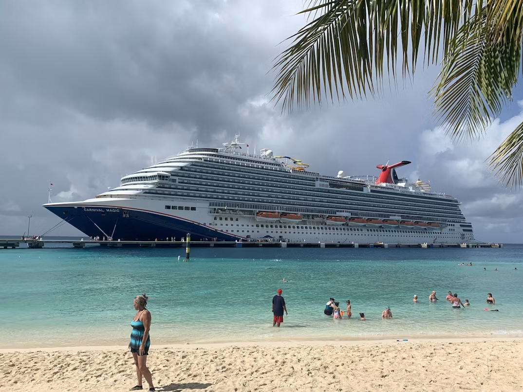 Cruise ship docked at a Caribbean beach